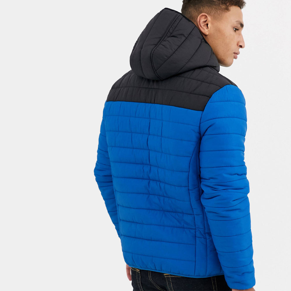 Backside of a man's blue quilted puffer jacket for winters